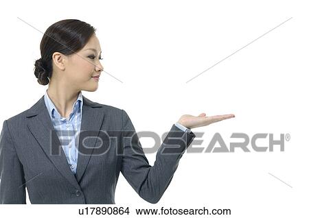 Picture - Businesswoman showing her palm. Fotosearch