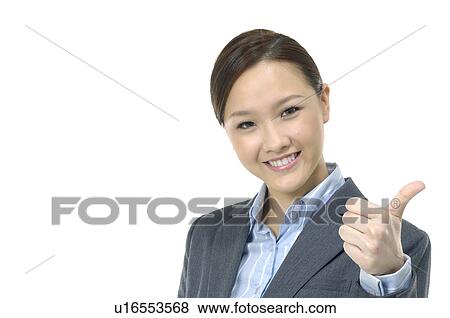 Stock Photo - Businesswoman showing her thumb. Fotosearch