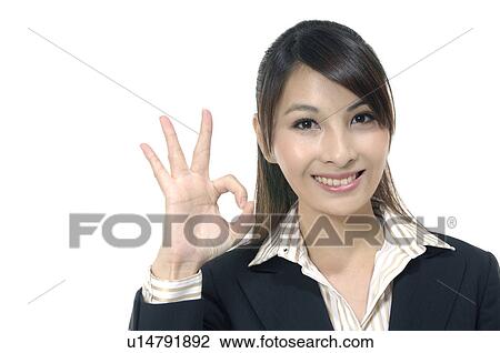Businesswoman showing OK sign View Large Photo Image Stock Image - Businesswoman showing OK sign. Fotosearch