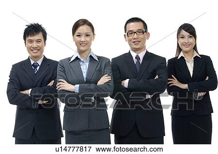 Four businesspeople standing with their arms crossed View Large Photo Image Stock Photo - Four businesspeople standing with their arms crossed. Fotosearch