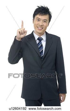 Portrait of a businessman pointing upwards View Large Photo Image Stock Image - Portrait of a businessman pointing upwards. Fotosearch