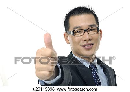 Stock Photo - Portrait of a businessman showing thumbs up. Fotosearch