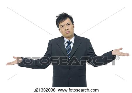 Stock Photo - Portrait of a businessman shrugging. Fotosearch