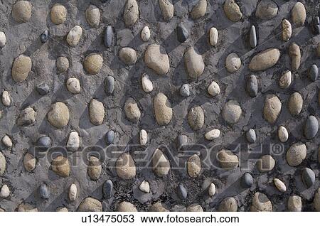 Pebbles embedded on Wall View Large Photo Image Stock Image - Pebbles embedded on Wall. Fotosearch