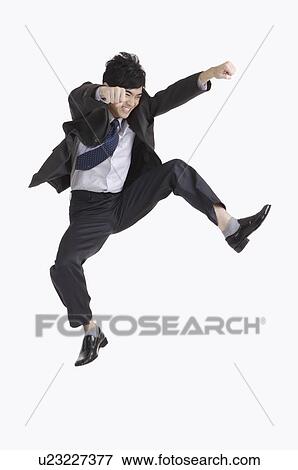 Young man fighting with mouth open and arms outstretched View Large Photo Image Stock Photo - Young man fighting with mouth open and arms outstretched. Fotosearch