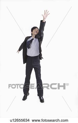 Picture - Young man reaching out hands and smiling with mouth open. Fotosearch