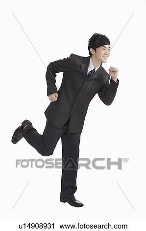 Young man running with smile View Large Photo Image Stock Image - Young man running with smile. Fotosearch