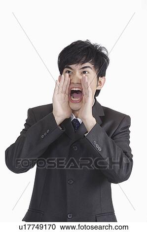 Young man shouting with mouth open and looking away View Large Photo Image Stock Image - Young man shouting with mouth open and looking away. Fotosearch