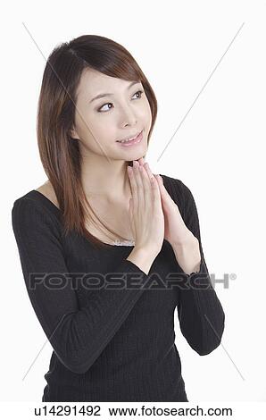 Young woman looking away and wishing View Large Photo Image Stock Image - Young woman looking away and wishing. Fotosearch