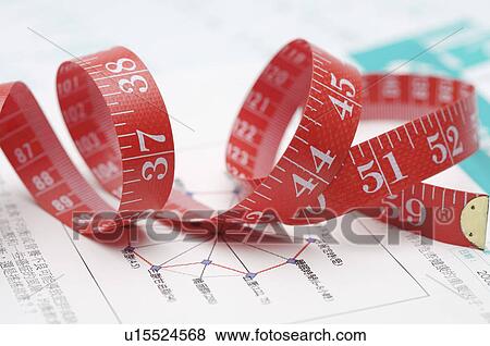 Close-up of a red tape measure View Large Photo Image Stock Photo - Close-up of a red tape measure. Fotosearch