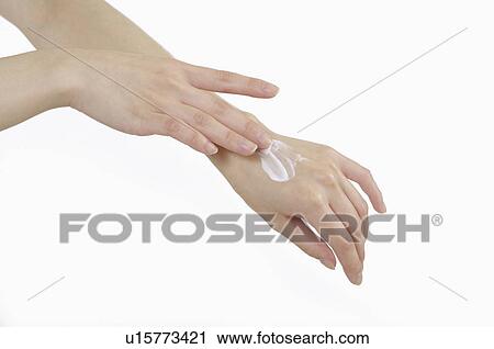 Close-up of human hands applying lotion for skin care View Large Photo Image Stock Image - Close-up of human hands applying lotion for skin care. Fotosearch