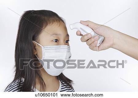 Girl wearing surgical mask and having medical exam View Large Photo Image Stock Image - Girl wearing surgical mask and having medical exam. Fotosearch