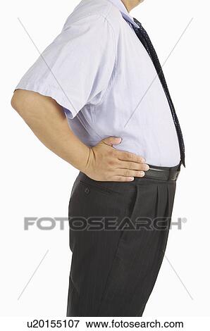 Man standing with arms akimbo on waist View Large Photo Image Stock Photo - Man standing with arms akimbo on waist. Fotosearch