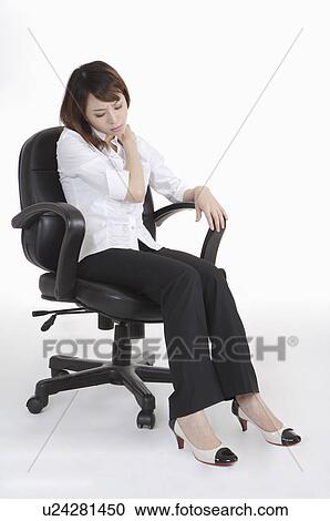 Young office lady rubbing neck for emotional stress View Large Photo Image Stock Image - Young office lady rubbing neck for emotional stress. Fotosearch