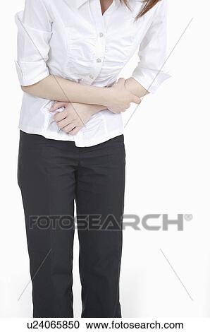 Young woman putting hands on stomach of stomach View Large Photo Image Stock Image - Young woman putting hands on stomach of stomach. Fotosearch