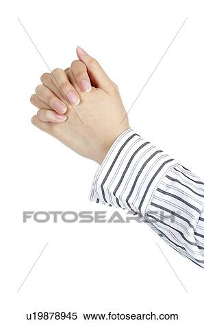 Stock Photography - Close-up of human hands gesturing with finger crossed. Fotosearch