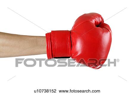 Stock Image - Close-up of human hands wearing a boxing glove. Fotosearch