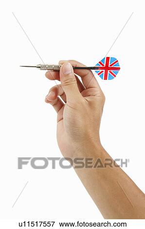 Stock Photo - Human hand holding a dart. Fotosearch