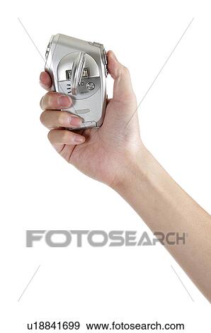Stock Photo - Human hand holding a electric razor. Fotosearch