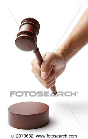 Human hand holding a gavel View Large Photo Image Stock Image - Human hand holding a gavel. Fotosearch