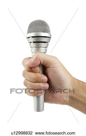 Human hand holding a microphone View Large Photo Image Stock Image - Human hand holding a microphone. Fotosearch