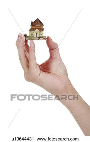 Human hand holding a model house View Large Photo Image Stock Image - Human hand holding a model house. Fotosearch