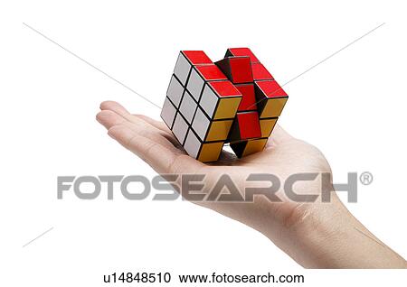 Human hand holding a puzzle cube View Large Photo Image Stock Image - Human hand holding a puzzle cube. Fotosearch