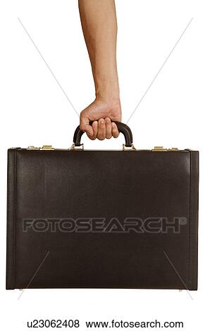 Stock Photo - Human hand holding a suitcase. Fotosearch