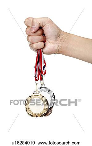 Human hand holding medal View Large Photo Image Stock Photo - Human hand holding medal. Fotosearch