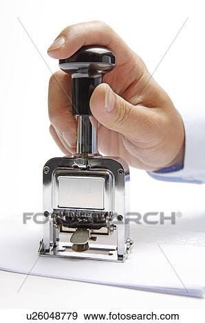 Stock Photo - Human hand pressing a seal. Fotosearch