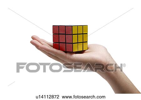 Human hand showing a puzzle cube View Large Photo Image Stock Image - Human hand showing a puzzle cube. Fotosearch