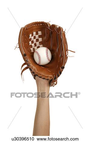 Stock Image - Human hand wearing baseball glove and holding a baseball. Fotosearch
