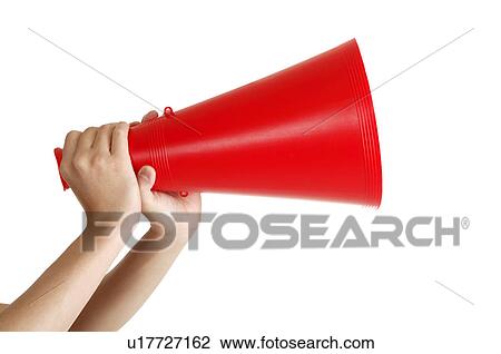 Stock Image - Human hands holding a megaphone. Fotosearch
