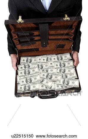 Stock Image - Human hands holding a suitcase with US paper currency. Fotosearch