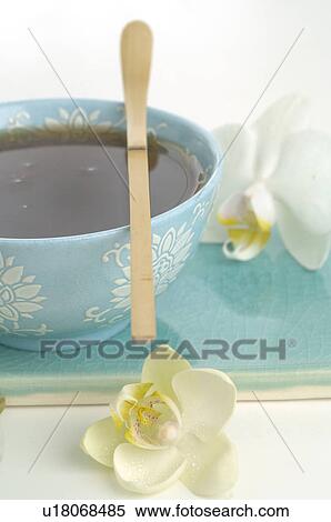 A cup of tea with a bamboo spoon View Large Photo Image Stock Photography - A cup of tea with a bamboo spoon. Fotosearch
