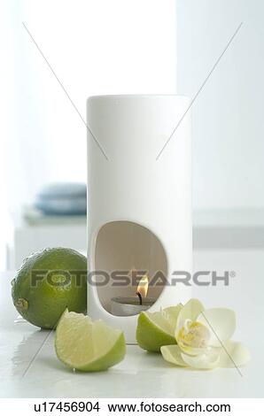 Picture - Aroma lamp and limes. Fotosearch