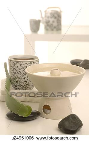 Arrangement of an aroma lamp, aloe and stones View Large Photo Image Stock Photograph - Arrangement of an aroma lamp, aloe and stones. Fotosearch