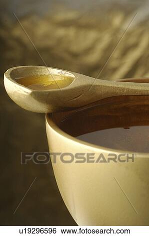 Stock Photograph - Cosmetic oil in a tub. Fotosearch