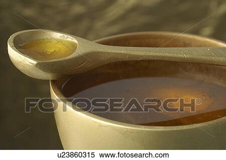 Stock Photography - Cosmetic oil in a tub. Fotosearch