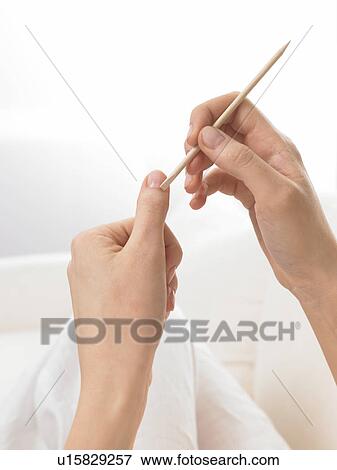 Stock Photo - Cuticle is being pushed back. Fotosearch