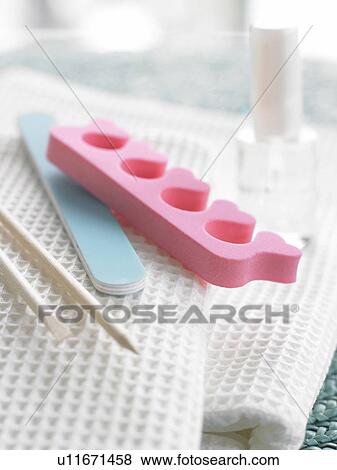 Stock Photo - Pedicure set placed on white piqué towels. Fotosearch