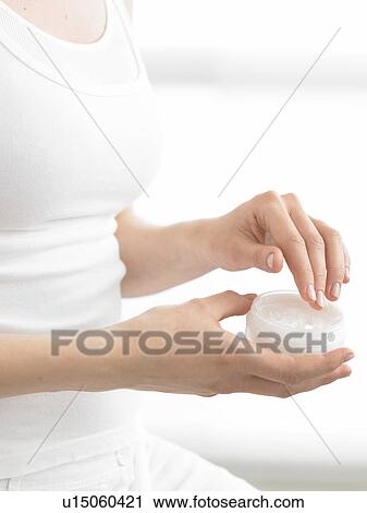 Woman with cream dish View Large Photo Image Stock Image - Woman with cream dish. Fotosearch