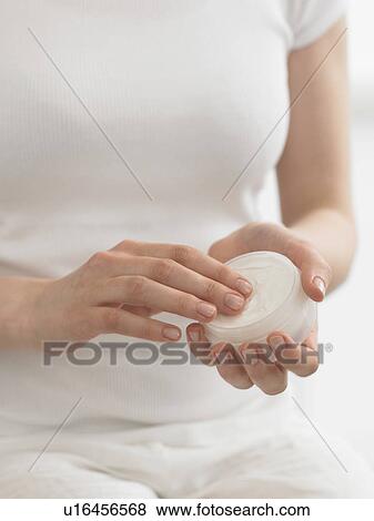 Woman with cream dish View Large Photo Image Stock Photo - Woman with cream dish. Fotosearch