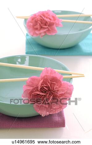 Asian bowls with chopsticks and blossoms View Large Photo Image Stock Photography - Asian bowls with chopsticks and blossoms. Fotosearch