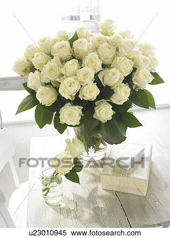 Bouquet of white roses and gifts View Large Photo Image Stock Photography - Bouquet of white roses and gifts. Fotosearch