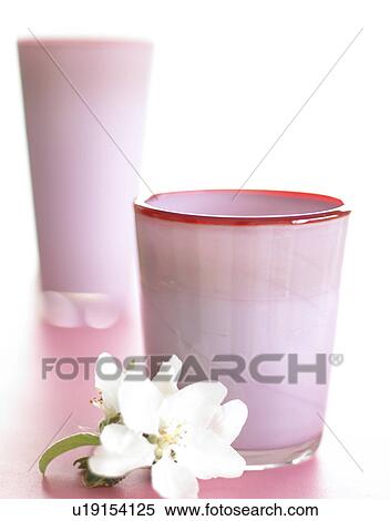 Stock Photography - Pale pink glass vases with spiderwort blossom. Fotosearch