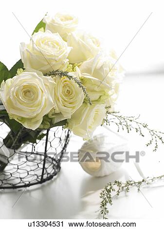 Withe roses in a iron basket View Large Photo Image Stock Image - Withe roses in a iron basket. Fotosearch
