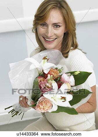 Picture - Woman with a bouquet. Fotosearch