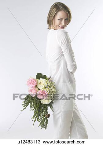 Woman with a bouquet View Large Photo Image Stock Image - Woman with a bouquet. Fotosearch