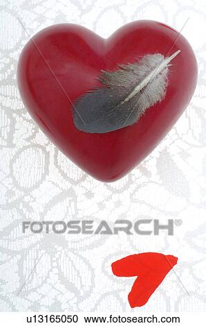Dark red heart and a feather View Large Photo Image Stock Image - Dark red heart and a feather. Fotosearch